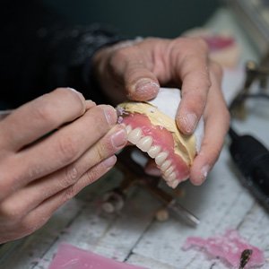 Lab tech making dentures