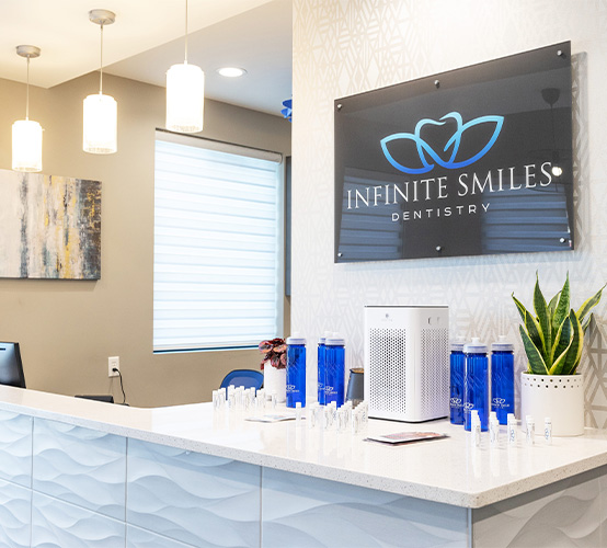 Dental team member and patient talking in modern dental treatment room