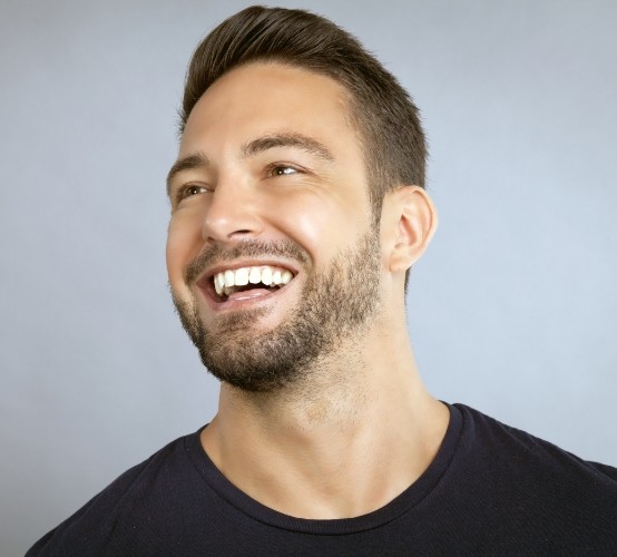 Man's flawless smile after metal free dental crowns
