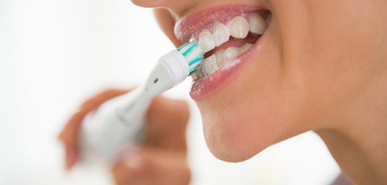 Woman brushing her teeth