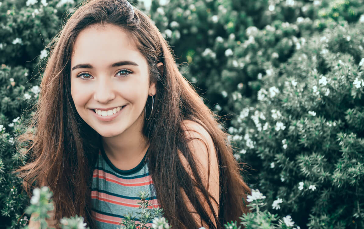 Smiling young woman in striped blouse