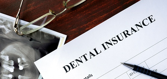 dental insurance form on table