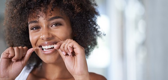 Closeup of woman eating a snack after her workout