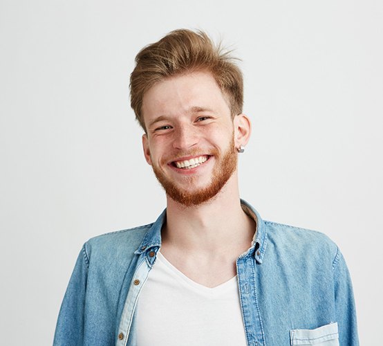 man smiling after getting teeth whitening in Owasso