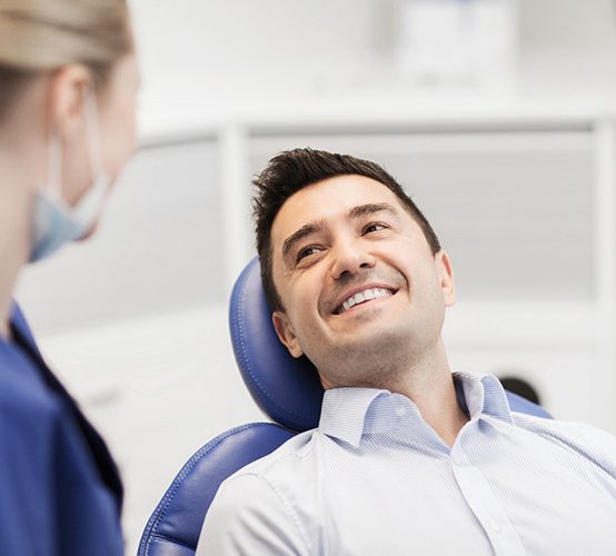 man visiting dentist for teeth whitening in Owasso 