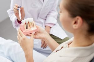 Patient visiting her dentist for a dental implant consultation