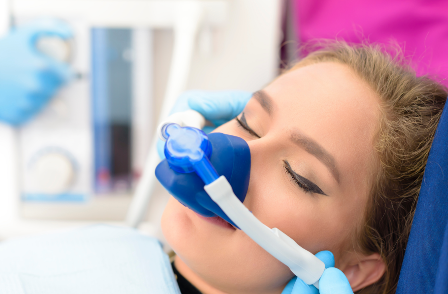 Woman undergoing dental sedation